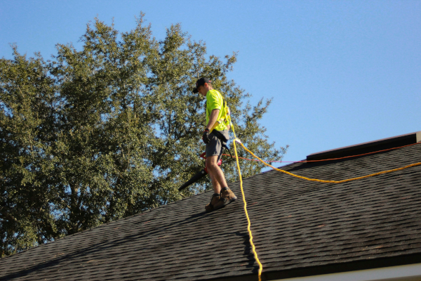 man on top of composite roof600